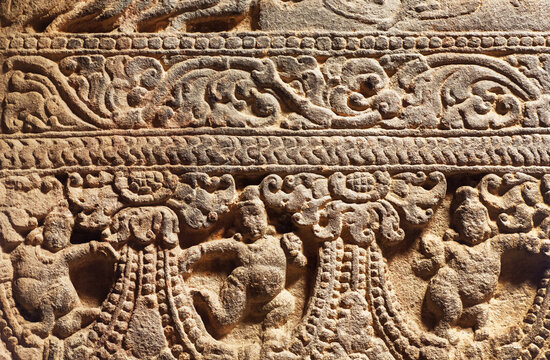 Stone patterns on ancient reliefs of abandoned temple in India. 