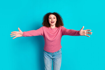 Fototapeta premium Photo of pretty young woman arms welcome you wear pink pullover isolated on teal color background