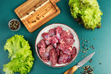 Raw deer venison prepared for a cooking process.