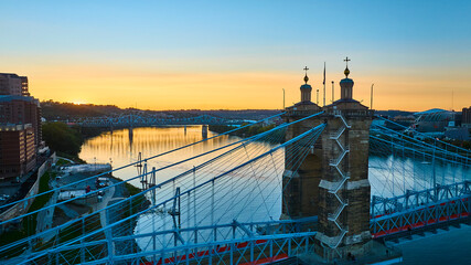 Fototapeta premium Aerial of John A Roebling Bridge at Sunset Over Ohio River