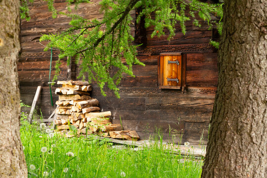 Swiss chalet detail with firewood stack