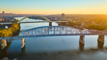 Fototapeta premium Aerial of Ohio River Bridges and Cincinnati Skyline at Sunrise