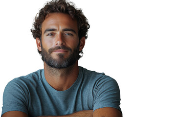 Obraz premium Confident young man with a beard, smiling gently, wearing a casual grey shirt, arms crossed against a white isolated background.