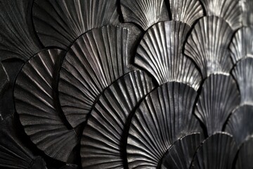 Obraz premium Dark metallic fan-shaped scales texture background.