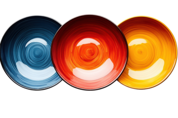 Three vibrant, colorful ceramic plates in blue, red, and yellow arranged in a row. Perfect for showcasing modern kitchen decor.