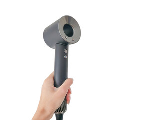 Close-up of a hand holding a modern, sleek hair dryer isolated on a transparent background.
