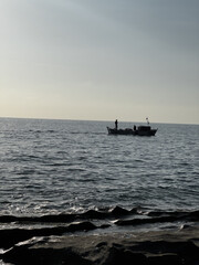 silhouette of a ship at sea sunset. High quality photo