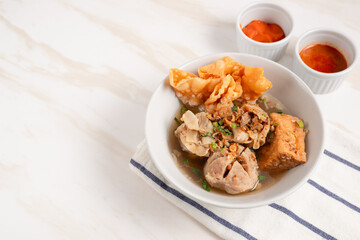 Bakso Arema, Meatballs Food Special from Malang East Java Indonesia. Close Up. Served with Soy Sauce, Sauce, and Chilli Paste