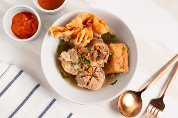 Bakso Arema, Meatballs Food Special from Malang East Java Indonesia. Close Up. Served with Soy Sauce, Sauce, and Chilli Paste