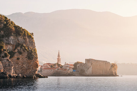 Scenic view of Budva old town at sunrise, showcasing its historic architecture and coastal beauty
