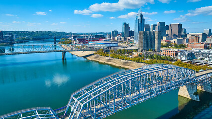 Fototapeta premium Aerial of Cincinnati Skyline with Ohio River and Steel Bridge