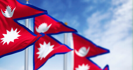 Close-up of Nepal National flag waving in the wind on a clear day