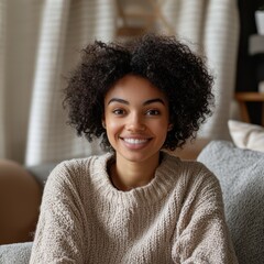 Fototapeta premium Head shot portrait smiling woman making video call to friends or relatives, using webcam, sitting on couch at home, happy young female blogger recording vlog, looking at camera, chatting online