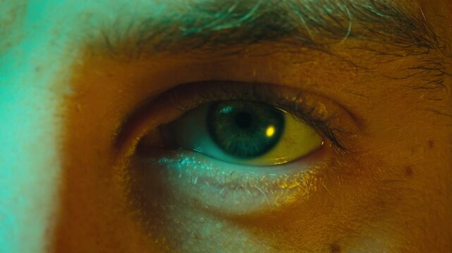 Detailed blue eye with strong gaze, showing human anatomy and beauty, thriller depression halloween style. Drugs concept.