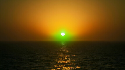 Breathtaking sunset over the ocean with a rare green flash illuminating the horizon