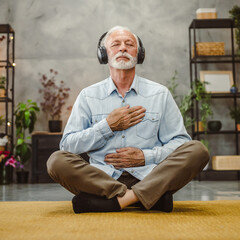senior male eyes closed have guided training yoga or meditation