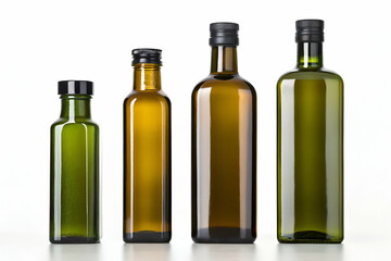 A collection of four glass bottles in varying sizes and shades of green, showcasing elegant designs ideal for oils or liquids.
