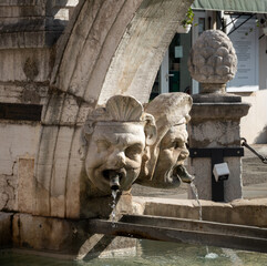 View of the ancient macarons (masks) sculpted in the historical da Ponte fountain, Preseren (Muda)...