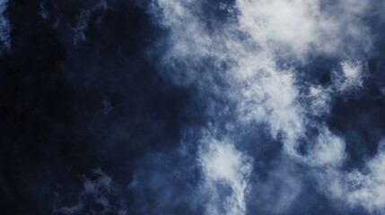 Obraz premium Ethereal clouds of deep navy, smoky gray, and silver mist drift and swirl across the frame, resembling cosmic nebulae and celestial fog. Soft, flowing patterns create a tranquil