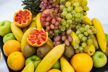 Fruit background, many fresh fruits mixed together.