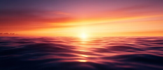 Fototapeta premium A serene sunset over calm ocean waters, creating a beautiful blend of colors in the sky and reflections on the surface.