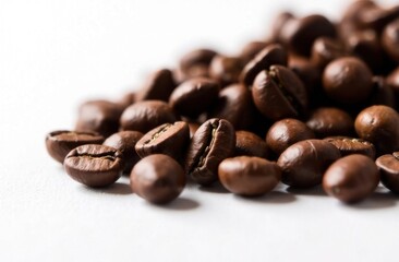 Naklejka premium Pile of Fresh Roasted Coffee Beans on White Background
