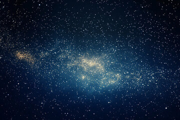 Fototapeta premium A dense cluster of stars forming a glowing golden galaxy against a vast and dark blue night sky 