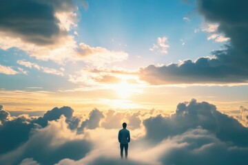 Fototapeta premium A person standing on a mountain peak, gazing out at the sky