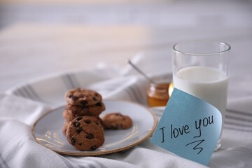 Romantic breakfast with note saying I Love You on table