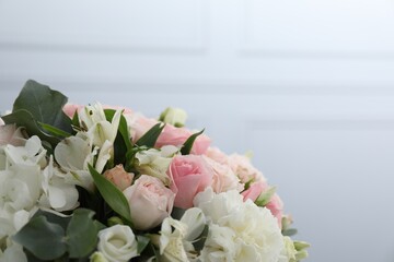 Bouquet of beautiful flowers on light background, closeup. Space for text