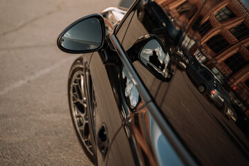 Left black wing mirror of modern car.