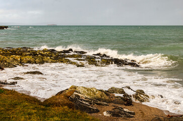 Waves crashing over the rocks at Groomsport Co. Down Northern Ireland
