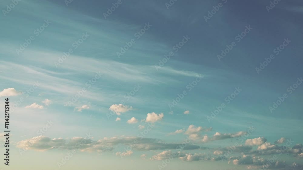 Poster Witness a stunning retro sunset as the sky transforms into vibrant hues, highlighted by soft clouds drifting throughout. Tranquil atmosphere evokes a sense of peace and reflection. Time lapse motion