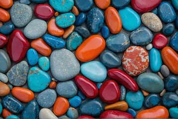 Colorful assortment of smooth stones and pebbles on the ground