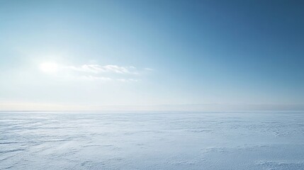 Obraz premium Endless snow-covered landscape under a clear blue sky during the early morning hours in a tranquil winter setting