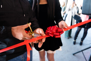 The opening of a house or a store, the moment of cutting the red ribbon