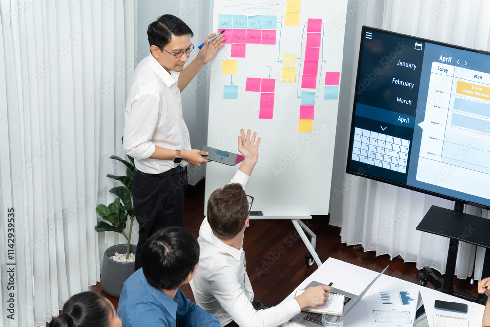Fototapete Project manager communicate and collaborate with team using project management software display on monitor, tracking progress of project task and making schedule plan at meeting table. Prudent