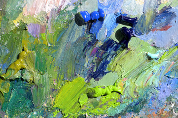 Abstract background of palette with mixed oil paints.