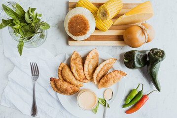 empanadas with garnishes and fresh ingredients