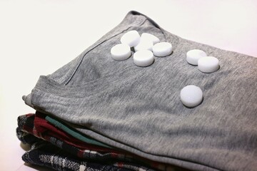 pile of clothes with camphor on top, as a clothes freshener. isolated on white background