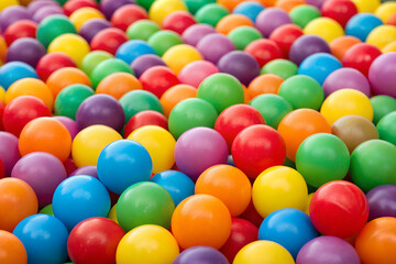 A vibrant array of colorful plastic balls scattered across a surface, creating a joyful and playful atmosphere.
