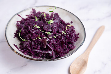 A close-up of sour, fermented red cabbage, probiotic-rich fermented food.