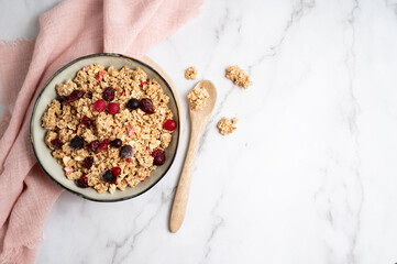 A bowl of wholegrain oatmeal muesli packed with crunchy nuts and dried fruits