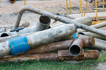 Water pipe replacement. Fragment of old rusty water pipes. Destroyed and corrosion flange and bolt nut on pipeline valve drain industrial. Damage tube. Supplying hot water, heating. Industrial concept