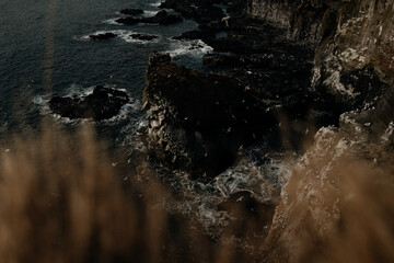 water flowing into the rocks on a rocky iceland coast