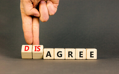 Agree or disagree symbol. Concept words Agree Disagree on beautiful wooden blocks. Beautiful grey table grey background. Businessman hand. Business agree or disagree concept. Copy space