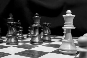 Chessmen photographed on a chessboard with a dark background