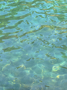 Green clear sea water surface.