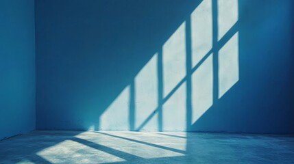 Obraz premium A blue room with a shadow of a window on the wall
