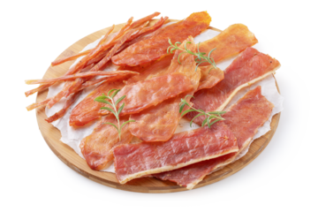 Four types of pork, chicken and turkey meat chips with rosemary sprigs on a round wooden tray isolated on a white background, smoked beer snack